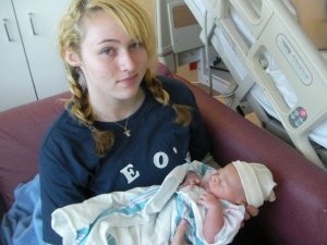 Kayla, age 16, holding her little brother Leo. This photo is from February 2009. The next baby Kayla holds will be her own.